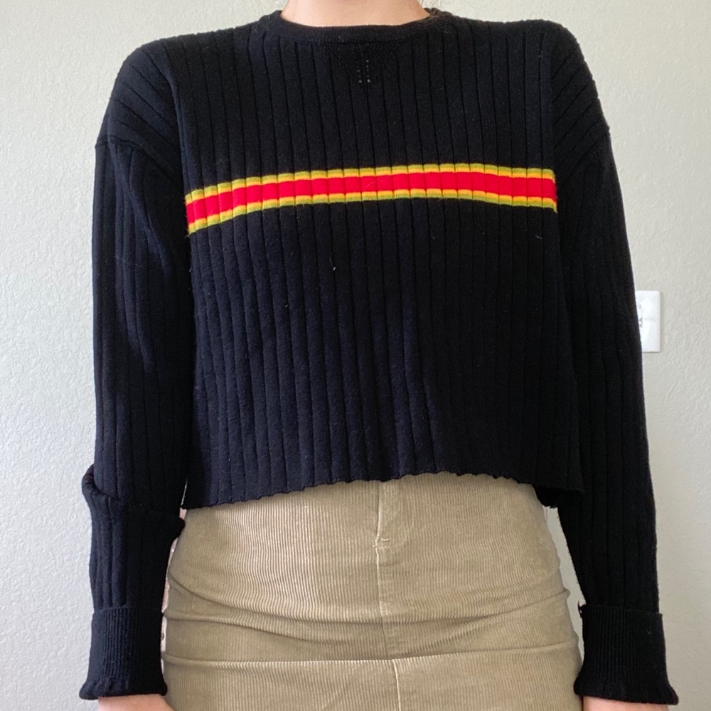 black pullover sweater with red & yellow stripes